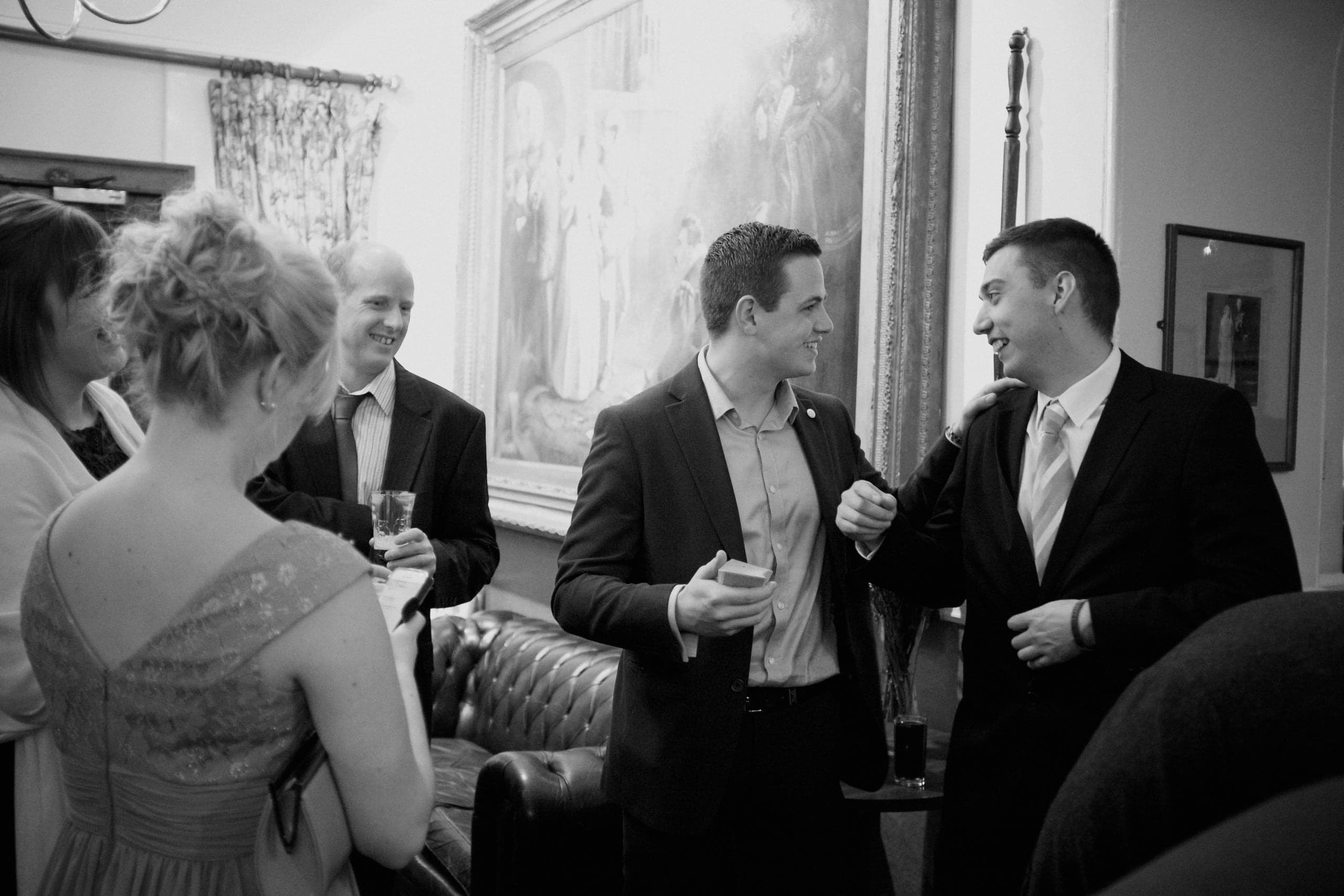 An elegant wedding venue moment during mingling entertainment.