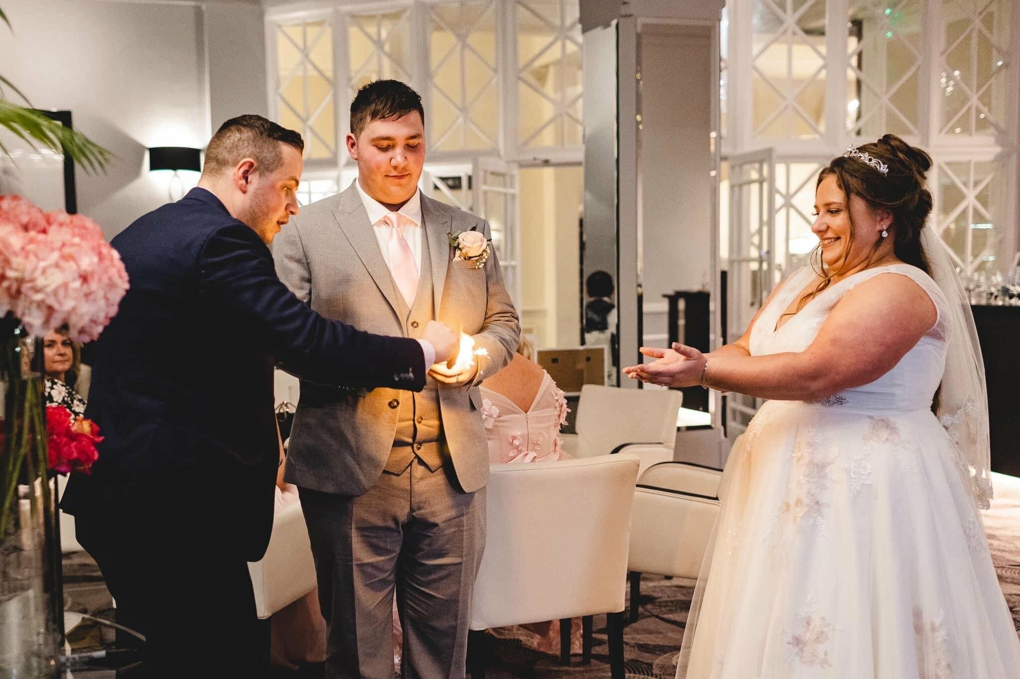 Couple enjoying a close-up wedding magic moment during the evening celebration.